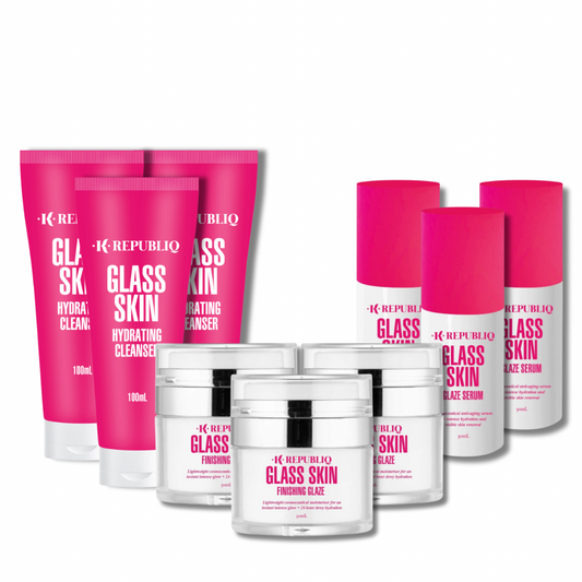 A set of K Republiq skincare products including three bottles labeled as Glass Skin Hydrating Cleanser, Glass Skin Glaze Serum, and Glass Skin Finishing Glaze, with vibrant pink packaging.