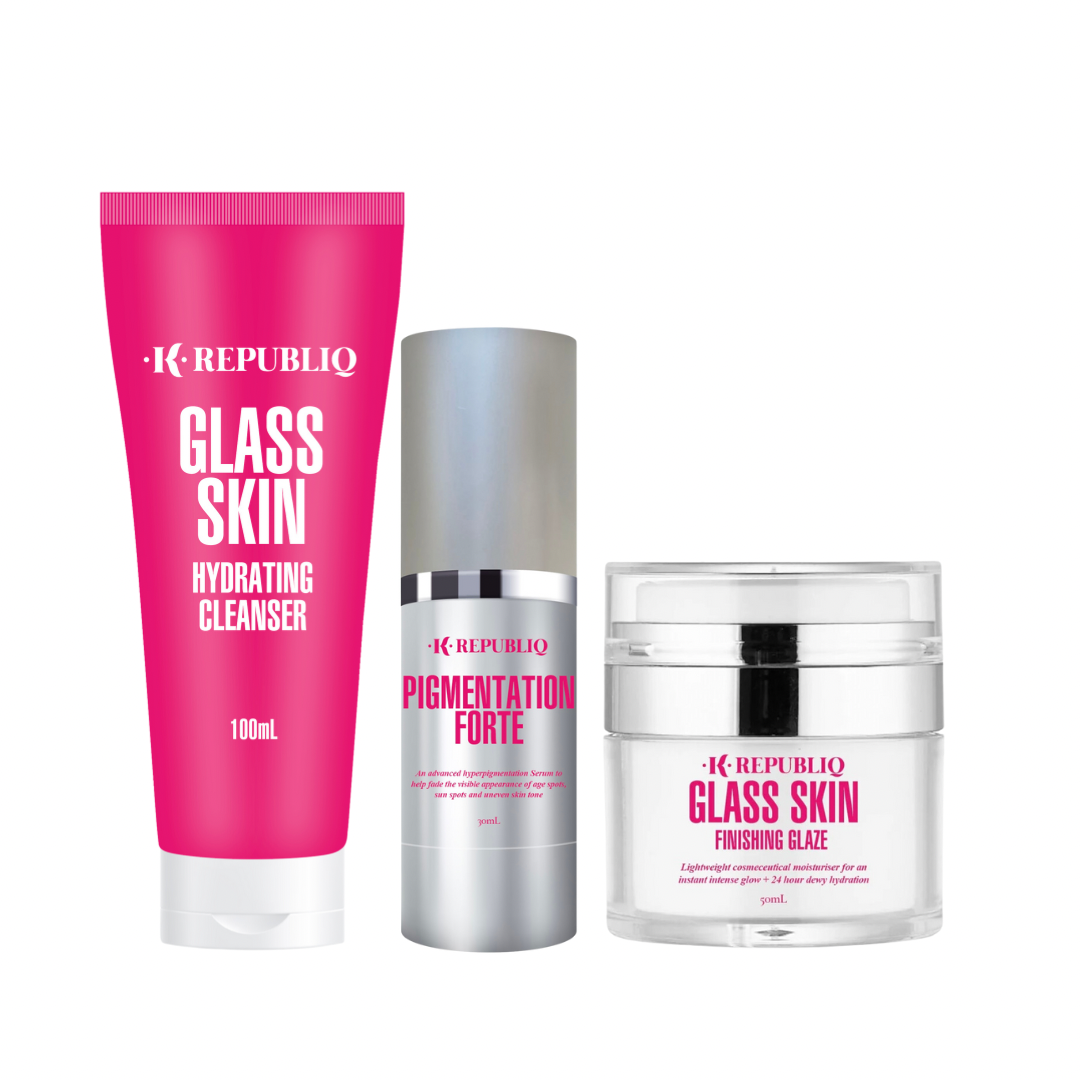 A set of three skincare products from K Republiq including a glass skin hydrating cleanser, a pigmentation forte serum, and a glass skin finishing glaze, packaged in pink and white containers.