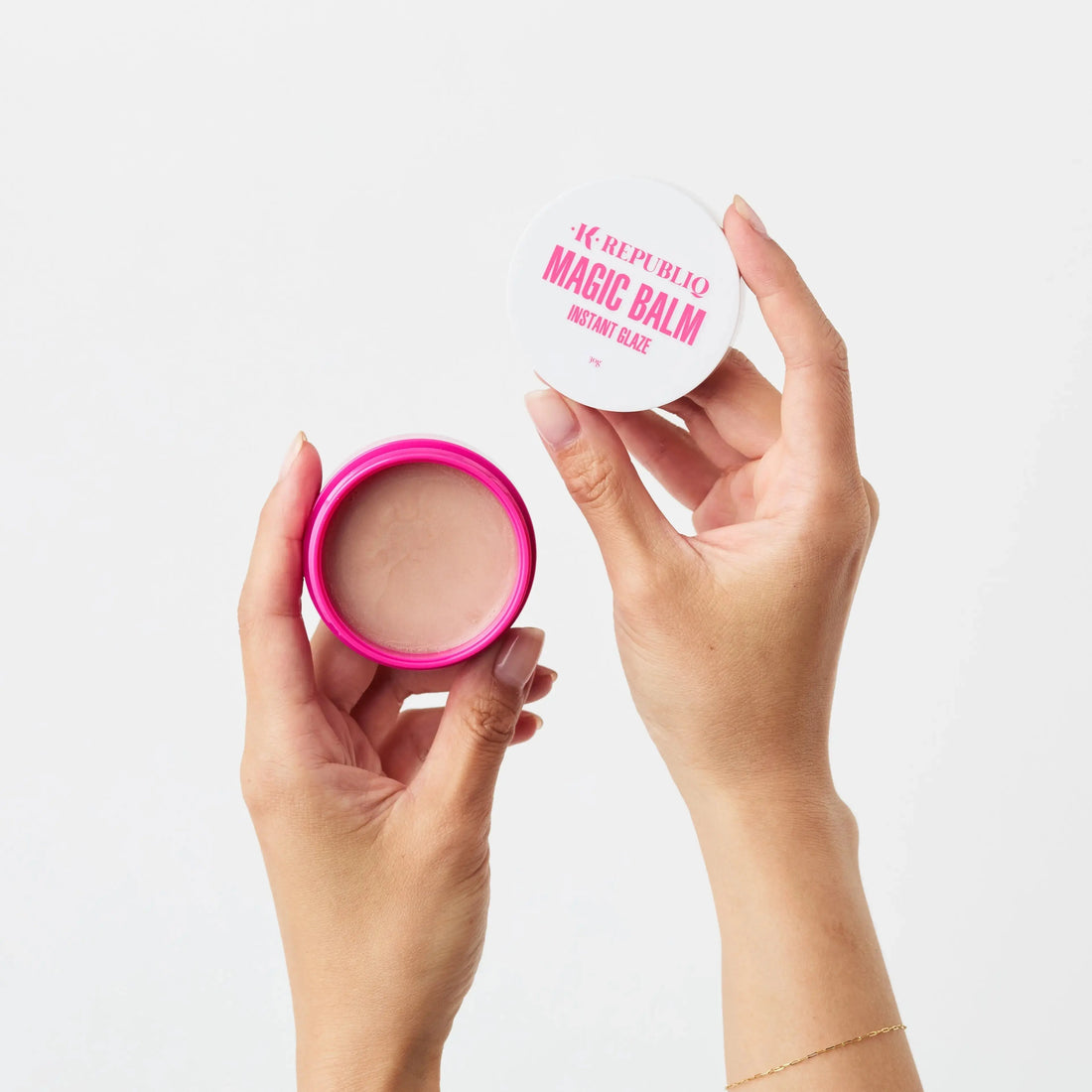 Woman applying balm to bare skin