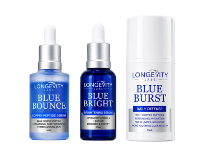 Three Longevity Labs skincare products on a light blue gradient background: Blue Bounce copper peptide serum in a blue bottle with a white dropper, Blue Bright brightening serum in a dark blue bottle with a silver dropper cap, and Blue Burst daily defense in a tall white tube.