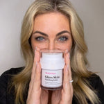 Radiant woman showing K Republiq Glass Skin Finishing Glaze product to camera