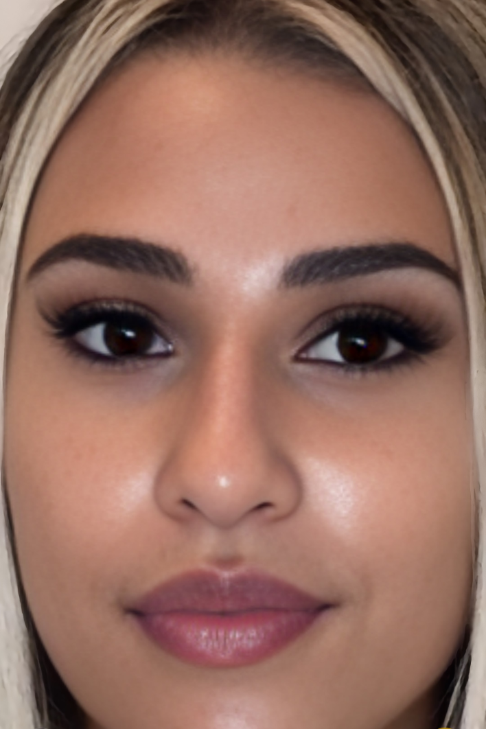 A close-up, head-on shot of a person's face with brighter, refreshed under-eyes