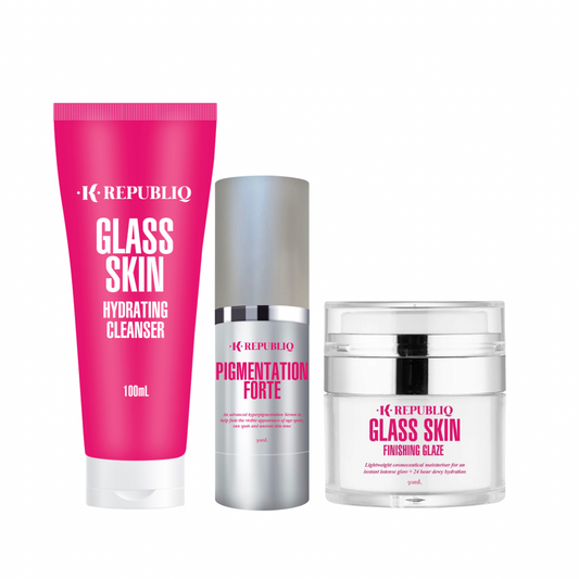 A set of three skincare products from K Republiq including a glass skin hydrating cleanser, a pigmentation forte serum, and a glass skin finishing glaze, packaged in pink and white containers.